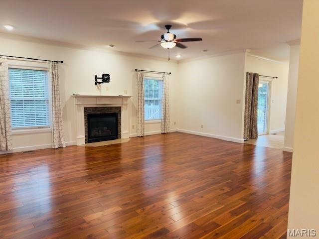 2063 Chesapeake Ave, Cape Girardeau, MO 63701 - unfurnished living room with a ceiling fan, healthy amount of natural light, a fireplace with flush hearth, baseboards, and ornamental molding