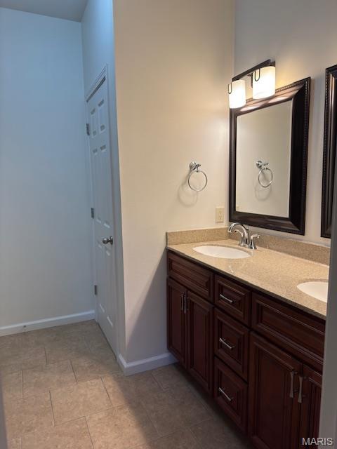 2063 Chesapeake Ave, Cape Girardeau, MO 63701 - full bath with double vanity, baseboards, and tile patterned flooring