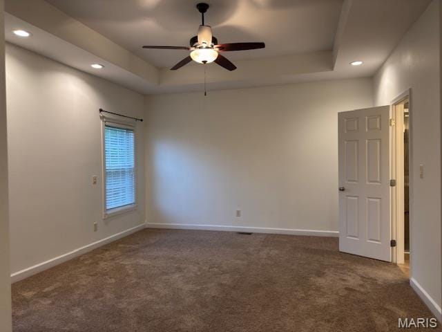 2063 Chesapeake Ave, Cape Girardeau, MO 63701 - empty room with carpet floors, ceiling fan, recessed lighting, baseboards, and a tray ceiling