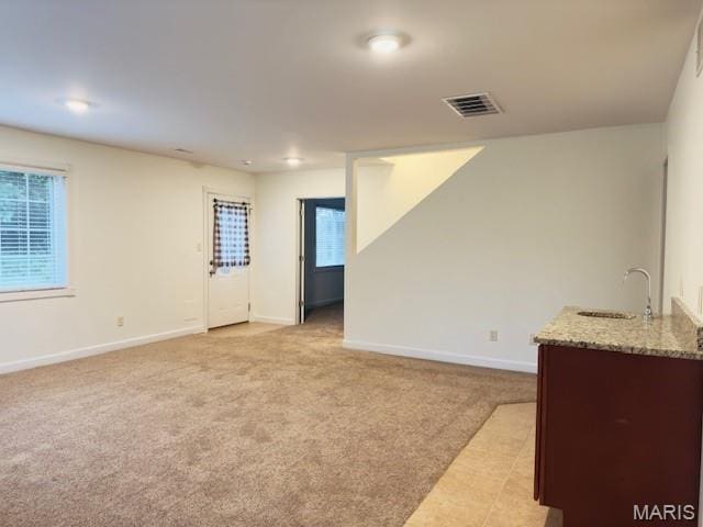 2063 Chesapeake Ave, Cape Girardeau, MO 63701 - spare room with a sink, baseboards, and light carpet