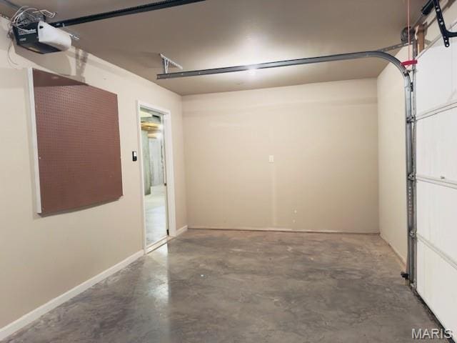 2063 Chesapeake Ave, Cape Girardeau, MO 63701 - garage featuring a garage door opener and baseboards