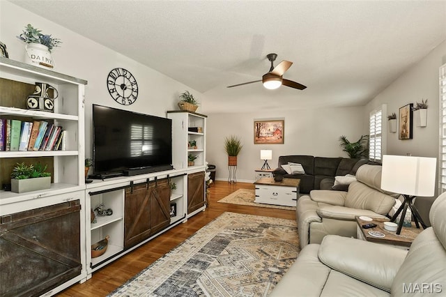 1522 S Oakland Ave, Bolivar, MO 65613 - living area featuring a ceiling fan and dark wood-style floors
