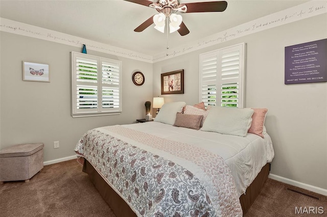 1522 S Oakland Ave, Bolivar, MO 65613 - carpeted bedroom featuring multiple windows, baseboards, and a ceiling fan
