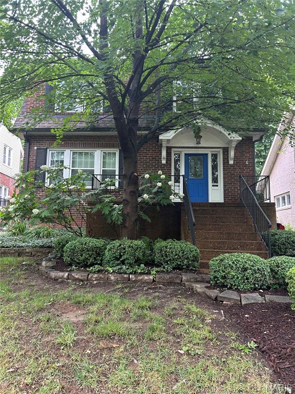 7041 Northmoor Dr, University City, MO 63105 - view of front facade featuring brick siding