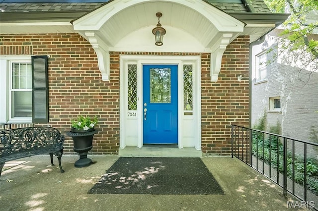 7041 Northmoor Dr, University City, MO 63105 - entrance to property featuring brick siding