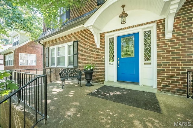 7041 Northmoor Dr, University City, MO 63105 - property entrance with brick siding