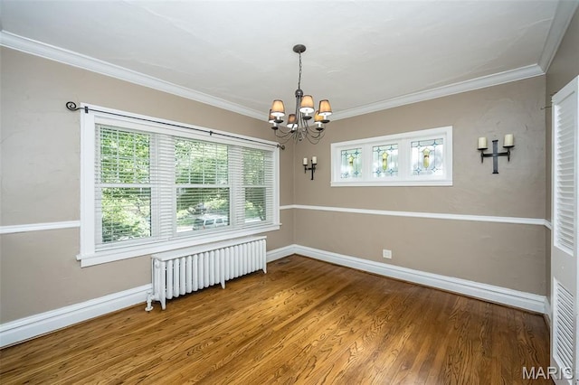 7041 Northmoor Dr, University City, MO 63105 - unfurnished room with radiator heating unit, a chandelier, wood finished floors, and crown molding