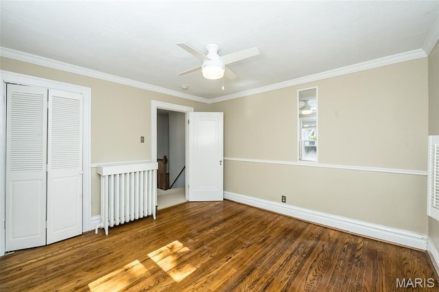 7041 Northmoor Dr, University City, MO 63105 - unfurnished bedroom featuring wood finished floors, crown molding, a closet, and a ceiling fan