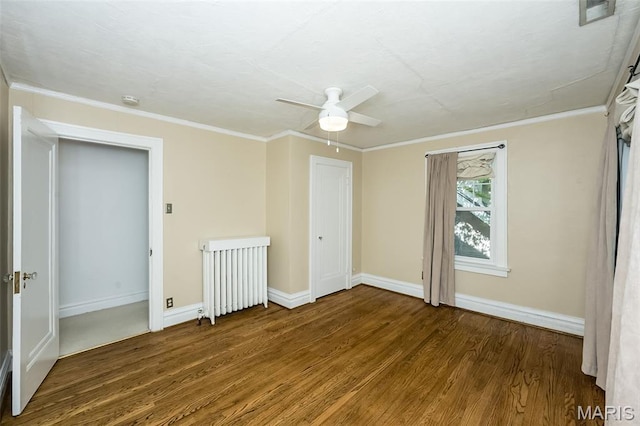 7041 Northmoor Dr, University City, MO 63105 - spare room with wood finished floors, a ceiling fan, ornamental molding, radiator heating unit, and a smoke detector