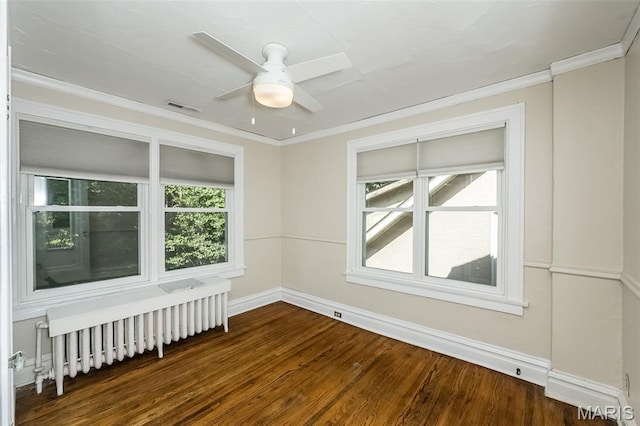 7041 Northmoor Dr, University City, MO 63105 - spare room with radiator, a ceiling fan, crown molding, and wood finished floors