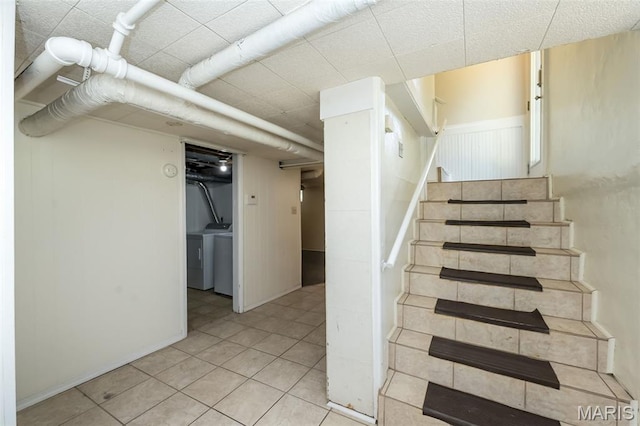 7041 Northmoor Dr, University City, MO 63105 - stairs featuring washer / clothes dryer and tile patterned flooring