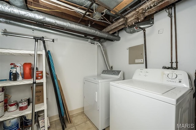 7041 Northmoor Dr, University City, MO 63105 - laundry room featuring washing machine and clothes dryer and light tile patterned floors