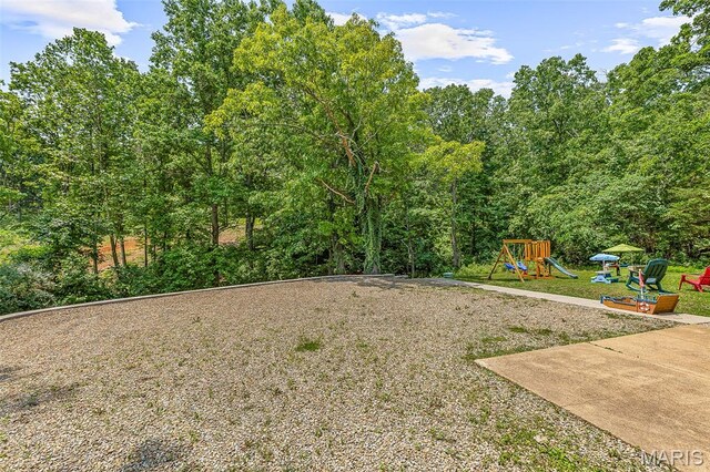 1764 Bourbon Dr, Bonne Terre, MO 63628 - view of green lawn with a playground