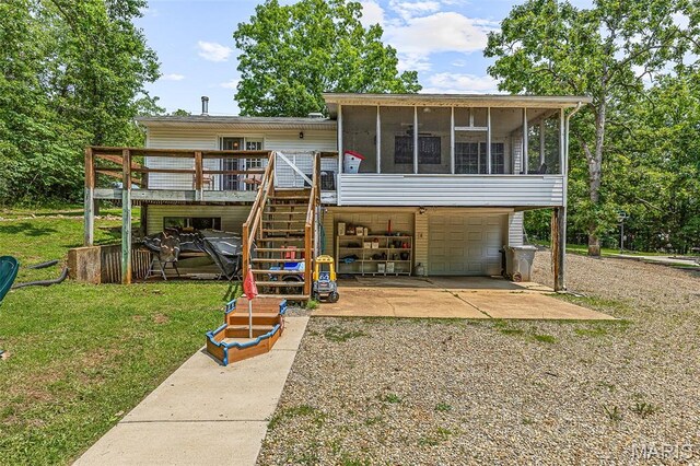 1764 Bourbon Dr, Bonne Terre, MO 63628 - back of property featuring a sunroom, an attached garage, gravel driveway, a deck, and stairway