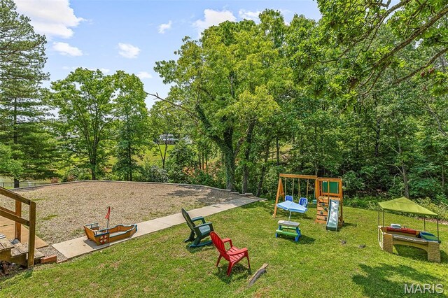 1764 Bourbon Dr, Bonne Terre, MO 63628 - view of grassy yard featuring a playground