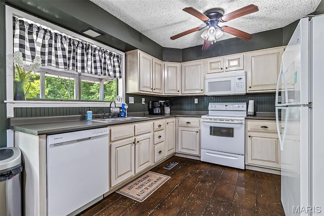 1764 Bourbon Dr, Bonne Terre, MO 63628 - kitchen with white appliances, dark wood-style flooring, a sink, a textured ceiling, and dark countertops