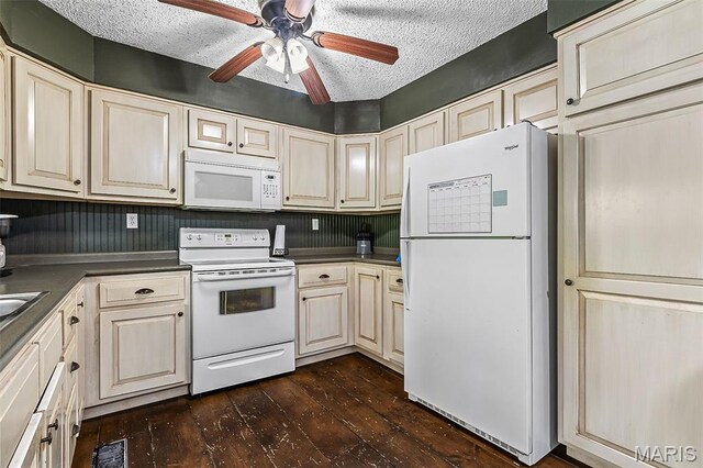 1764 Bourbon Dr, Bonne Terre, MO 63628 - kitchen with white appliances, dark wood-style flooring, a textured ceiling, dark countertops, and ceiling fan