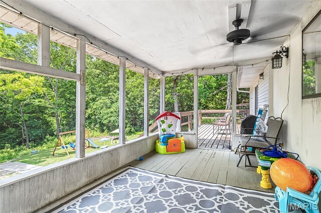 1764 Bourbon Dr, Bonne Terre, MO 63628 - unfurnished sunroom with a ceiling fan and view of wooded area