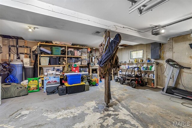 1764 Bourbon Dr, Bonne Terre, MO 63628 - basement featuring a garage, electric panel, and a workshop area