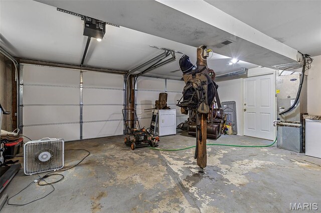 1764 Bourbon Dr, Bonne Terre, MO 63628 - garage with washer / clothes dryer and a garage door opener