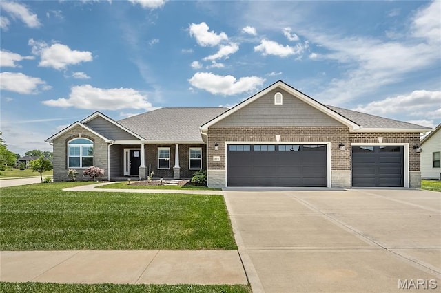 409 Sage Dr, Shiloh, IL 62221 - view of front of property with an attached garage, a front yard, brick siding, and driveway