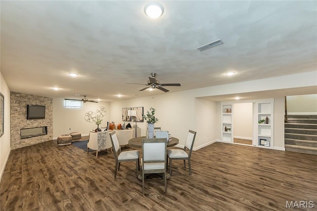 409 Sage Dr, Shiloh, IL 62221 - dining area with wood finished floors, a fireplace, baseboards, a ceiling fan, and recessed lighting