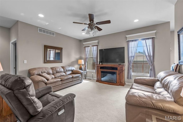 380 Stotler Way, Jackson, MO 63755 - carpeted living room featuring recessed lighting, ceiling fan, healthy amount of natural light, a glass covered fireplace, and baseboards
