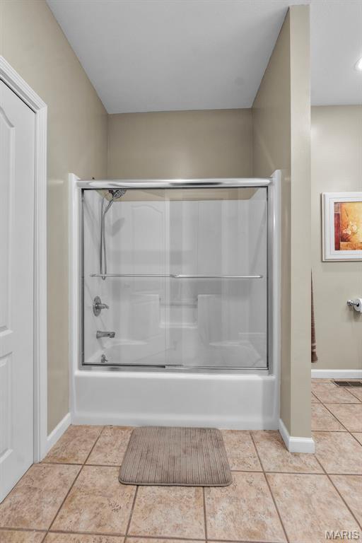 380 Stotler Way, Jackson, MO 63755 - bathroom with baseboards, bath / shower combo with glass door, and tile patterned floors