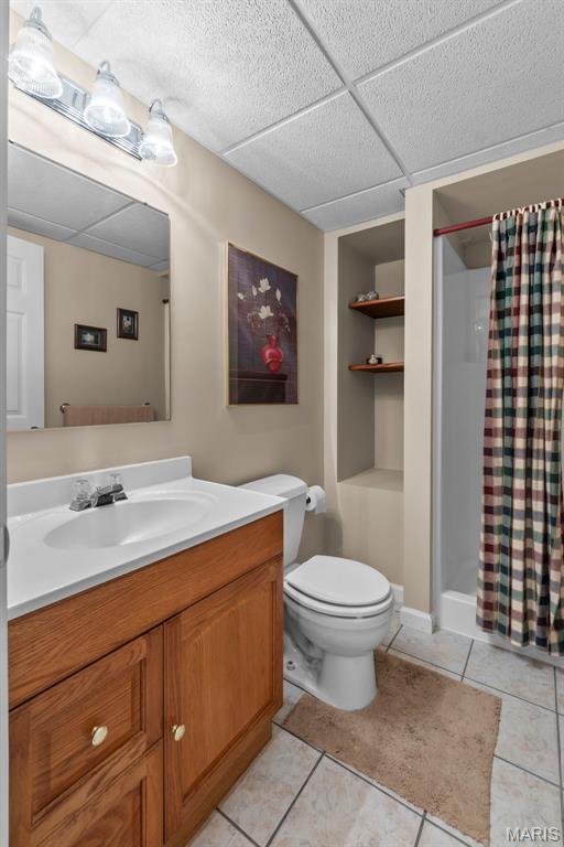 380 Stotler Way, Jackson, MO 63755 - full bath featuring a shower stall, vanity, tile patterned flooring, toilet, and built in features