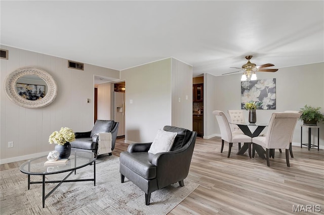 10009 Sakura Dr Unit A, Sappington, MO 63128 - living area with light wood-type flooring, ceiling fan, and baseboards