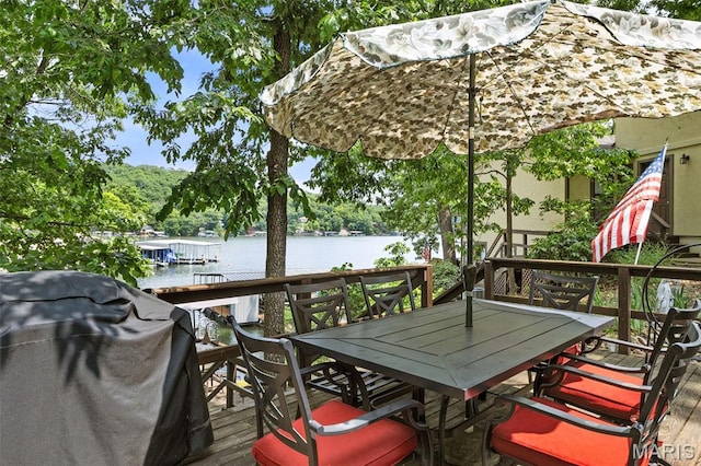 63 Portwood Meadows Rd, Rocky Mount, MO 65072 - wooden terrace featuring outdoor dining area, a water view, and grilling area
