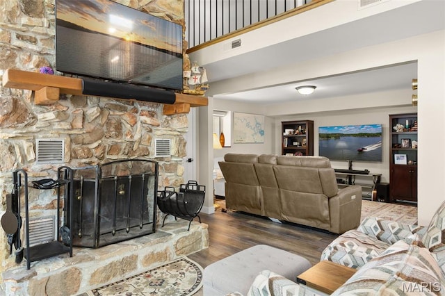 63 Portwood Meadows Rd, Rocky Mount, MO 65072 - living area featuring wood finished floors, a fireplace, and a high ceiling