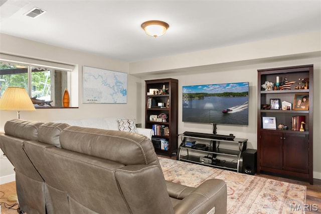 63 Portwood Meadows Rd, Rocky Mount, MO 65072 - living room with wood finished floors and baseboards