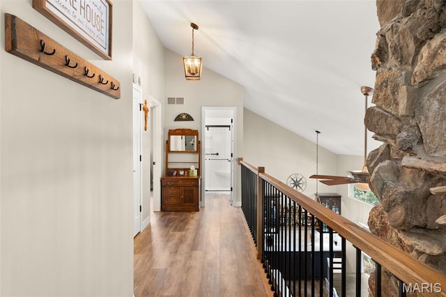 63 Portwood Meadows Rd, Rocky Mount, MO 65072 - corridor with wood finished floors, an upstairs landing, and high vaulted ceiling