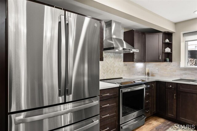 63 Portwood Meadows Rd, Rocky Mount, MO 65072 - kitchen with wall chimney range hood, stainless steel appliances, dark brown cabinetry, light countertops, and open shelves