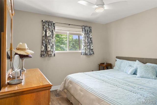 63 Portwood Meadows Rd, Rocky Mount, MO 65072 - bedroom with dark wood-type flooring, baseboards, and ceiling fan