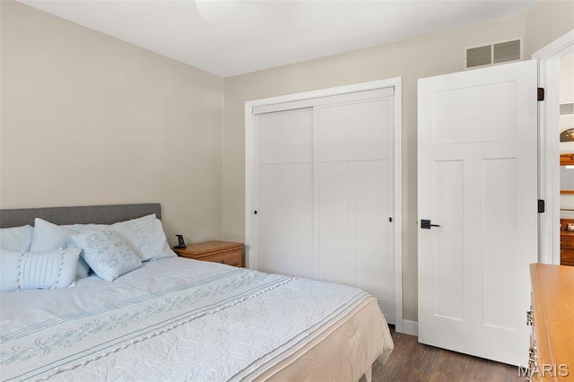 63 Portwood Meadows Rd, Rocky Mount, MO 65072 - bedroom with dark wood-type flooring and a closet