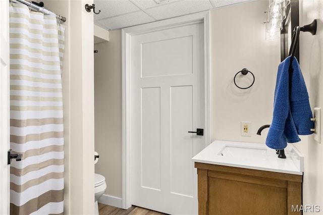 63 Portwood Meadows Rd, Rocky Mount, MO 65072 - bathroom featuring toilet, vanity, a paneled ceiling, wood finished floors, and curtained shower