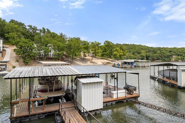 63 Portwood Meadows Rd, Rocky Mount, MO 65072 - dock featuring boat lift and a water view