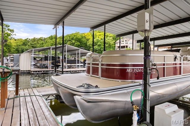 63 Portwood Meadows Rd, Rocky Mount, MO 65072 - dock featuring boat lift and a water view