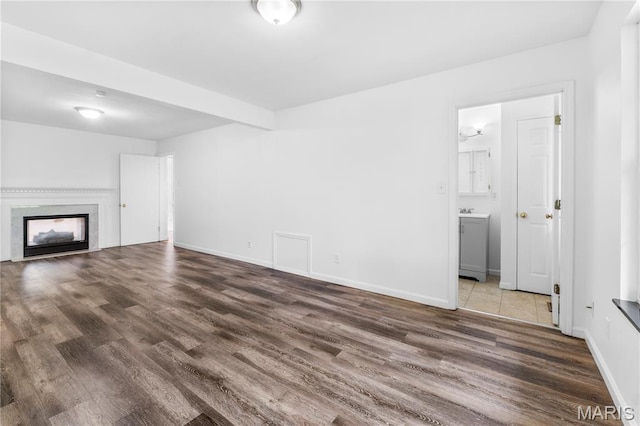 10735 Wurdack Ave, Saint Louis, MO 63114 - unfurnished living room with wood finished floors and a premium fireplace
