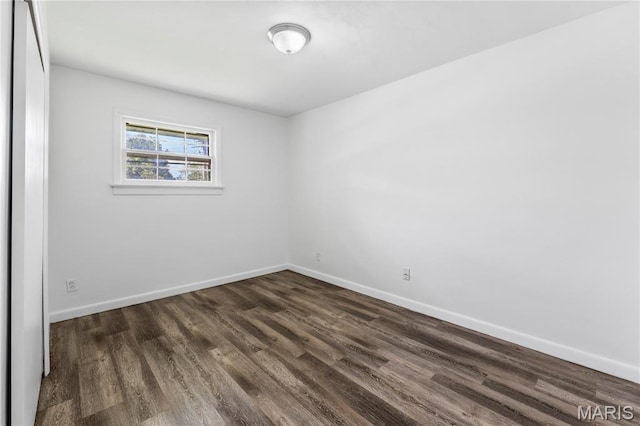 10735 Wurdack Ave, Saint Louis, MO 63114 - unfurnished room with dark wood-style flooring and baseboards