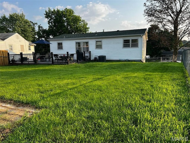 16 Wauneta Pl, Hannibal, MO 63401 - back of property featuring central air condition unit and a patio area