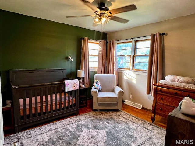 16 Wauneta Pl, Hannibal, MO 63401 - bedroom with wood finished floors, baseboards, and ceiling fan