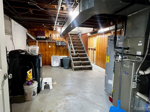 16 Wauneta Pl, Hannibal, MO 63401 - unfinished below grade area featuring wood walls, water heater, stairway, independent washer and dryer, and heating unit