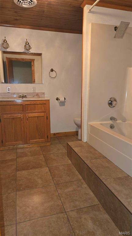 11863 Windy Curve Ln, Success, MO 65570 - full bath with wooden ceiling, vanity, shower / washtub combination, toilet, and tile patterned floors