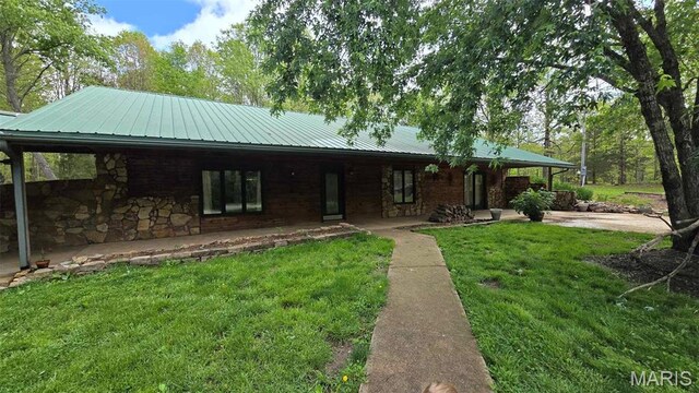 11863 Windy Curve Ln, Success, MO 65570 - view of front of home with stone siding, a front lawn, and metal roof