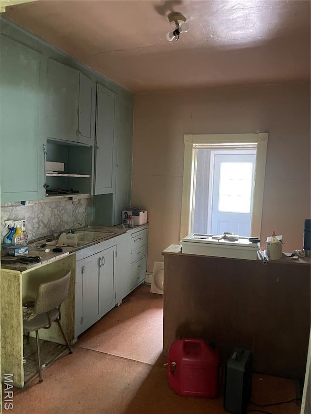 1908-19 Hope St, Hannibal, MO 63401 - kitchen with tasteful backsplash and a sink