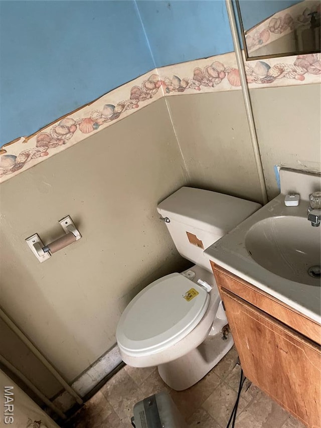 1908-19 Hope St, Hannibal, MO 63401 - bathroom featuring vanity and toilet