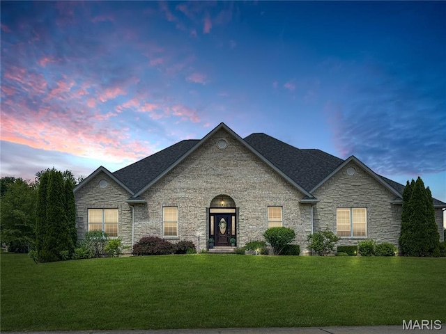495 Oak Field Ct, Washington, MO 63090 - view of front of house with a front lawn, stone siding, and a shingled roof